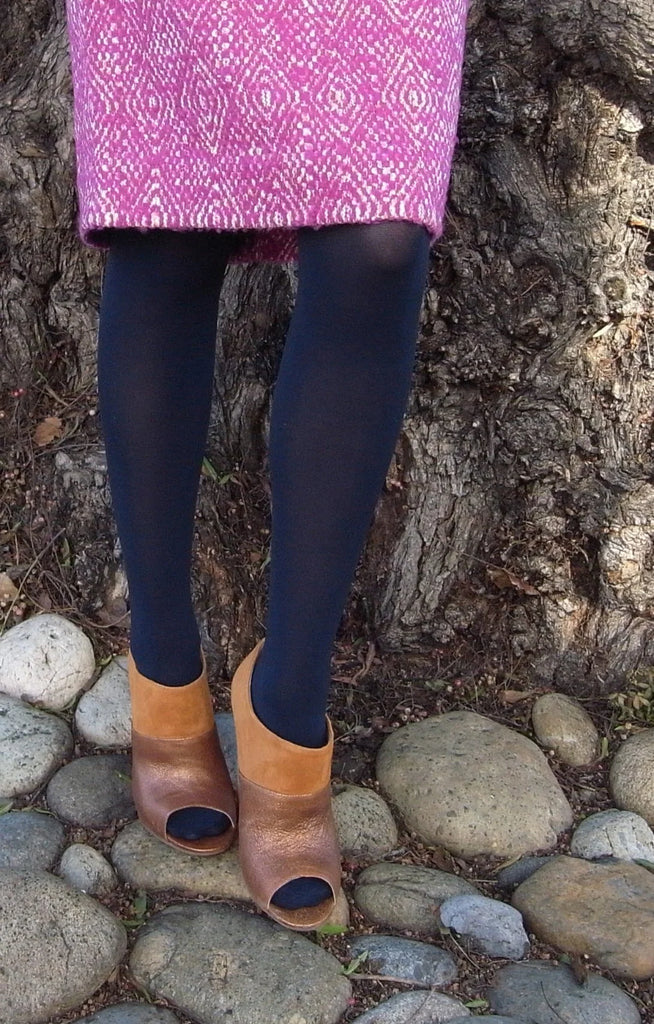 Woman wearing Tabbisocks 23 Colors Opaque Zokki Tights in navy with pink skirt and brown boho boots