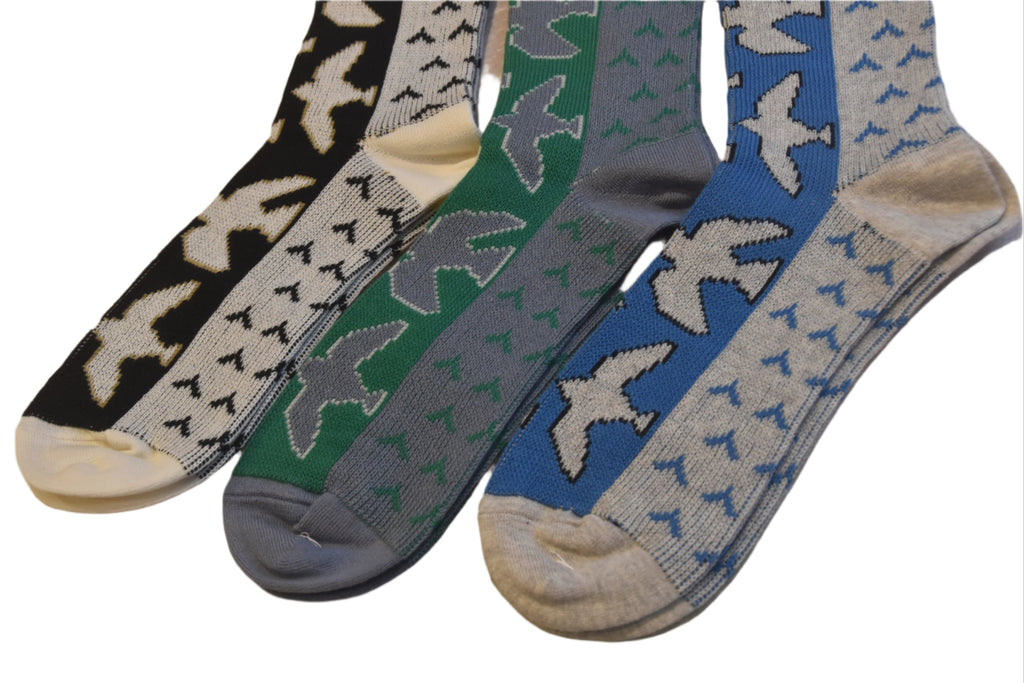 Four pairs of socks with bird pattern on a white background