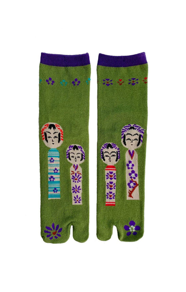 The pattern is a Japanese Kokeshi doll in the Matcha color of NINJA SOCKS' Kokeshi Doll Tabi Toe Socks