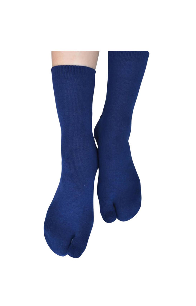 Feet wearing blue color of a product called Wool Blend Solid Tabi Socks by NINJA SOCKS