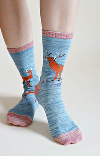 TABBISOCKS brand Replant Pairs Deer Organic Cotton Crew Socks in Steel Blue color with Rose colored deer pattern on the mouth, toe and heel.