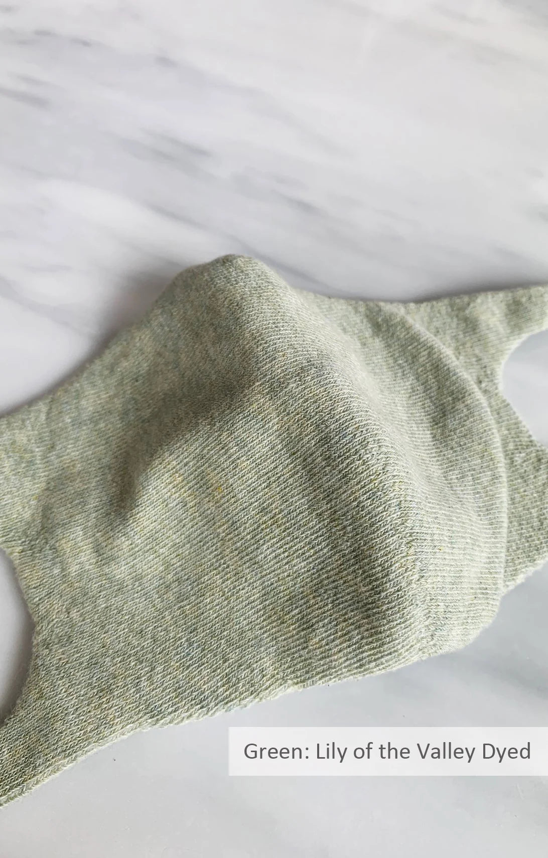 Green color of Botanical Dyed Organic Cotton Face Mask by Tabbisocks Wellness