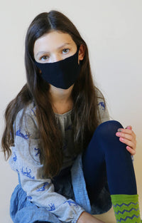 Girl with long hair wearing Tabbisocks Wellness Organic Cotton Face Mask For Kid-Youth in Black
