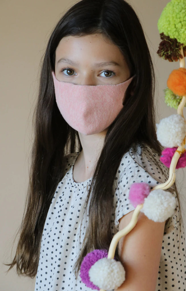 Girl with long hair wearing Tabbisocks Wellness Organic Cotton Face Mask For Kid-Youth in Pink