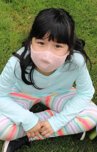 Girl wearing Tabbisocks Wellness Organic Cotton Face Mask For Kid-Youth in Pink