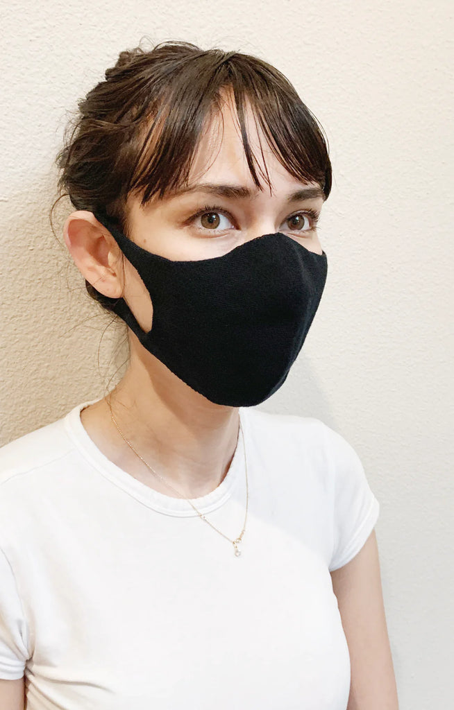 Woman in white T-shirt wearing Black color of The Japanese Seamless Comfort Face Mask by Tabbisocks Wellness