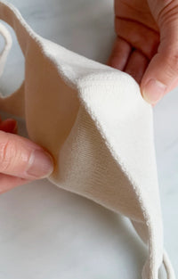 Close-up of the natural ivory middle part of the Tabbisocks Wellness Japanese Seamless Comfort Face Mask