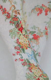 Zoomed in photo of antique flower tights.