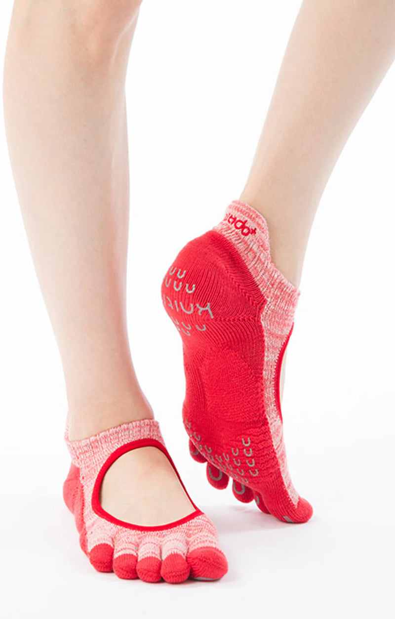 Woman's foot wearing red Heather Toe Footie Grip Socks With *Power Pads* by Knitido plus