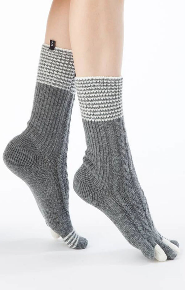Side view of a leg wearing Knitido plus's Wool Blend Cable Striped Midcalf Toe Socks in GREY color