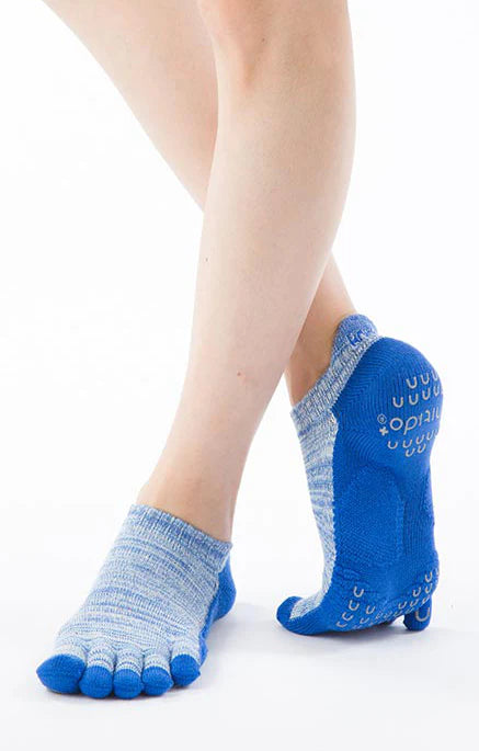 This is a front view of a leg wearing the brand name Knitido+ product HEATHER FOOTIE TOE GRIP SOCKS WITH *POWER PADS* BLUE color