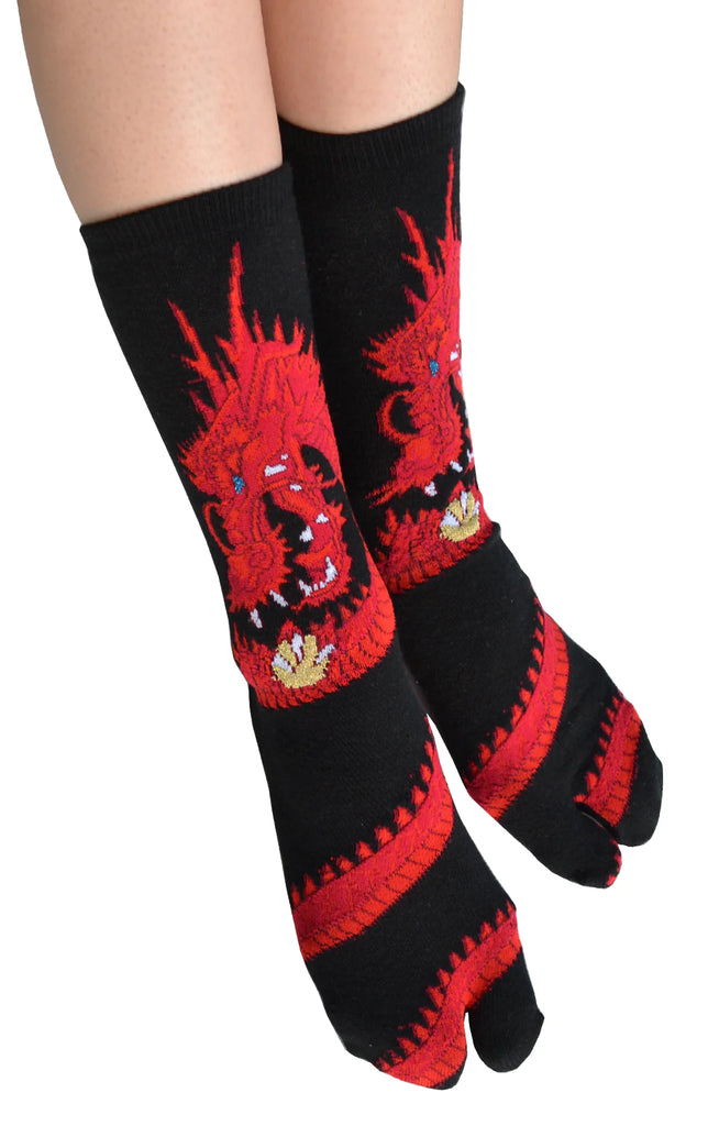 Photo of a leg of a woman wearing the product name DRAGON TABI SOCKS Red with dragon design of NINJA SOCKS
