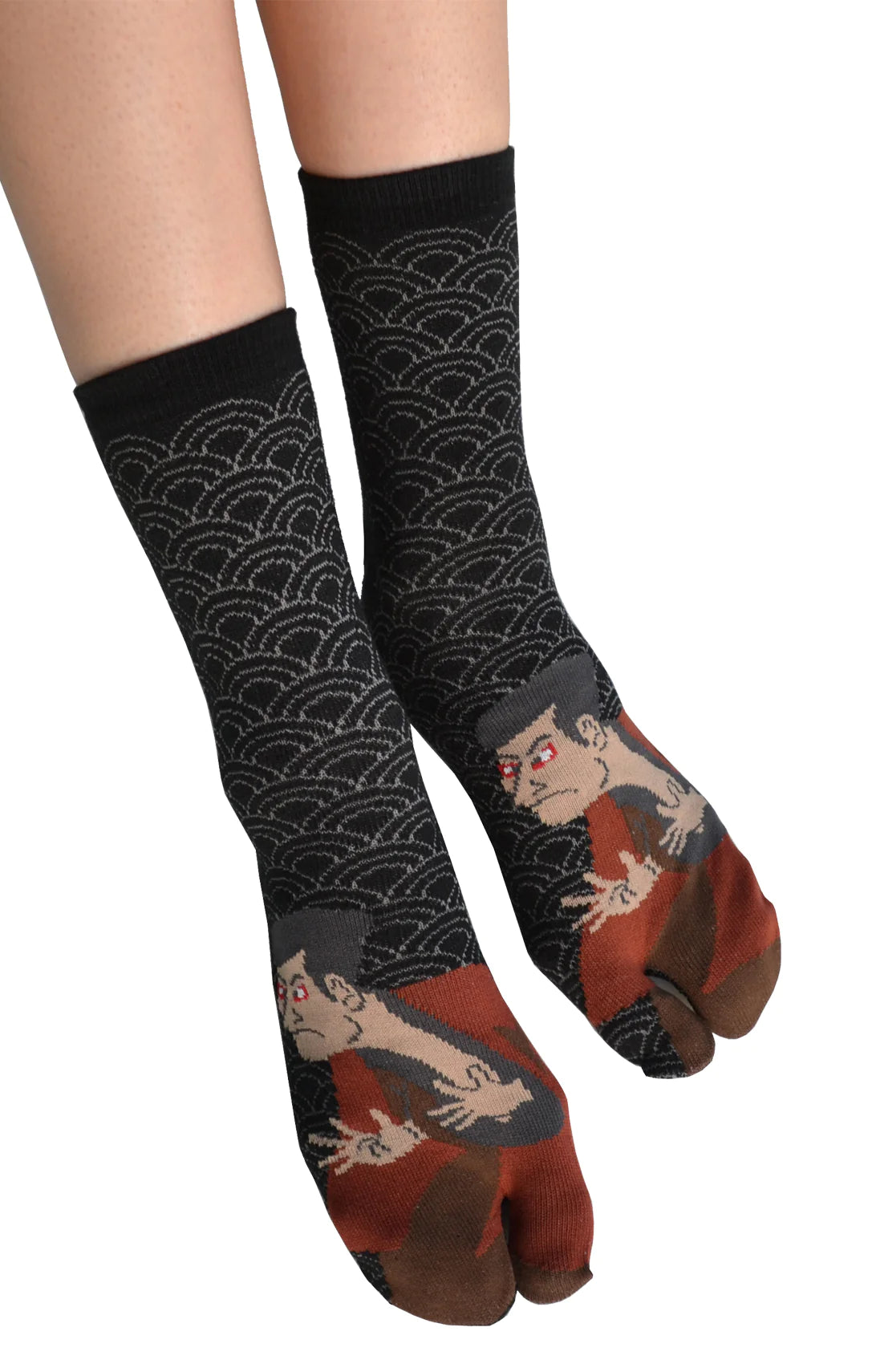 A woman is wearing KABUKI TABI TOE SOCKS Black, a product name inspired by Japanese Kabuki by NINJA SOCKS
