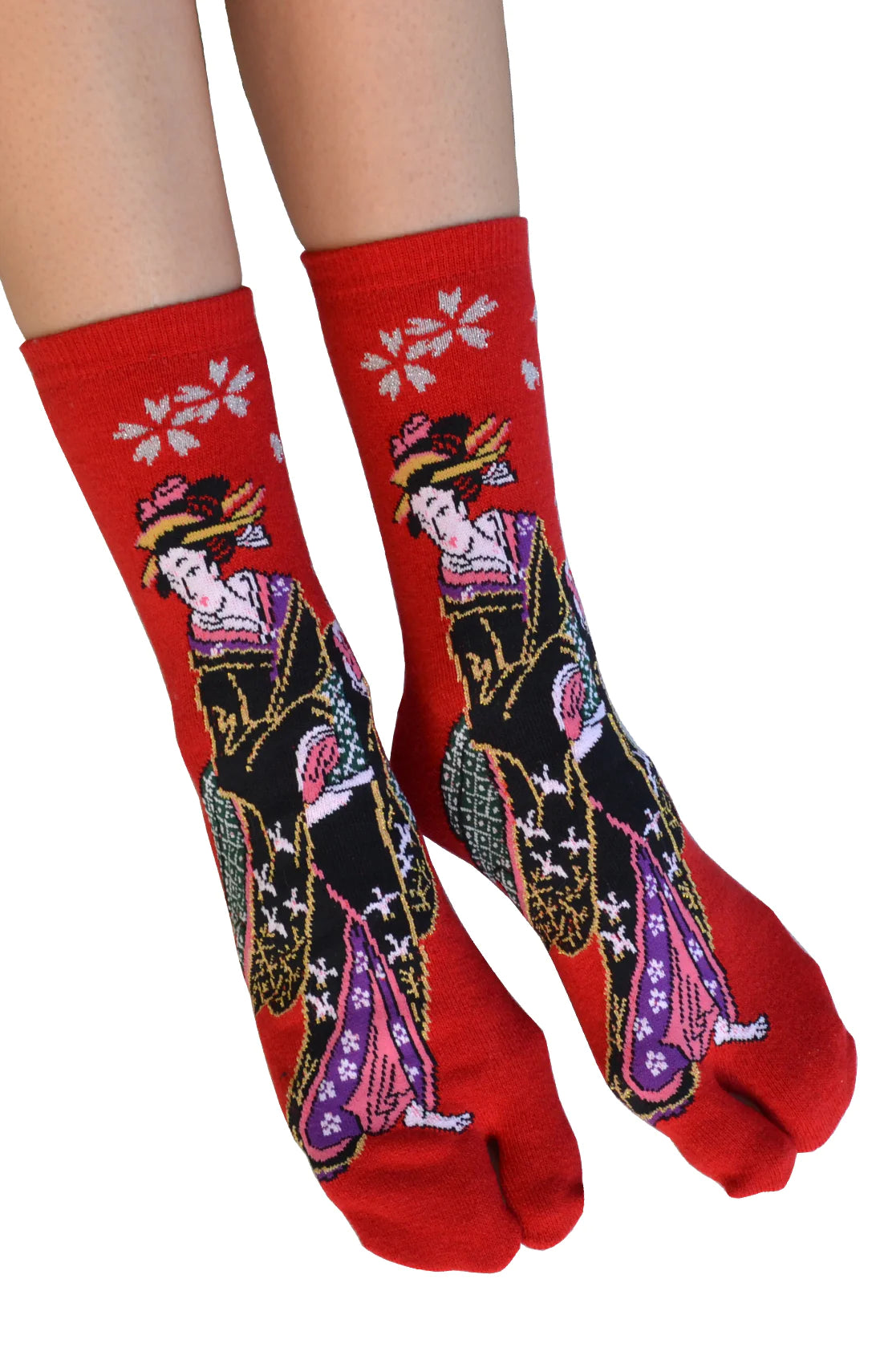 This is a photo of a woman's leg wearing the red color of the product name KABUKI TABI TOE SOCKS of the brand name NINJA SOCKS