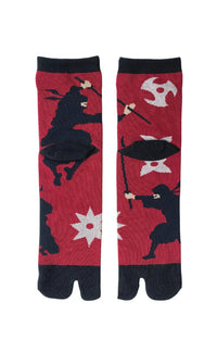 Socks with the trade name Ninja Tabi Toe Socks by NINJA SOCKS, back view in RED BLACK color with a design of ninja fighting with swords