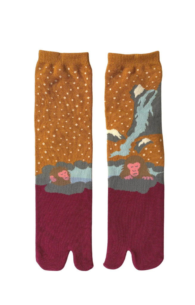NINJA SOCKS' product name Onsen Monkey Saru Tabi Toe Socks, front view in MUSTARED PINK color with a design of a monkey taking a bath in a hot spring