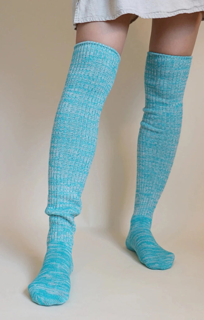 This is a photo of a woman's leg wearing Tabbisocks' product name Scrunchy Over The Knee Lounge Wool Blend Socks Mint