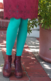 Mint color of Tabbisocks 23 Colors Opaque Zokki Tights with wine-colored leather skirt and reddish brown leather boots