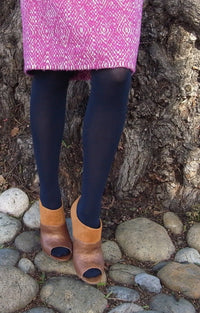 Woman wearing Tabbisocks 23 Colors Opaque Zokki Tights in navy with pink skirt and brown boho boots
