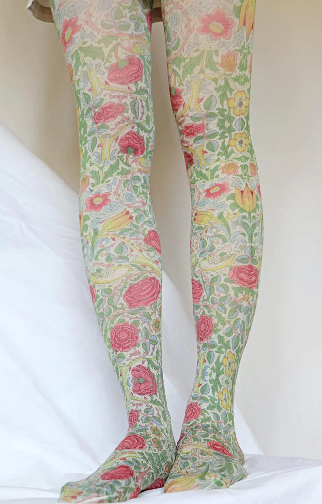 Woman's leg wearing Tabbisocks Bird And Rose By William Morris Printed Art Tights with red and yellow flower pattern