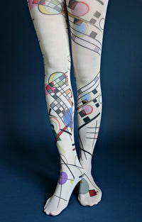 Tabbisocks Composition Viii By Wassily Kandinsky Printed Art Tights in navy blue, fabric is light greenish color, geometric pattern with red, pink, light blue, green and other square and circle symbols
