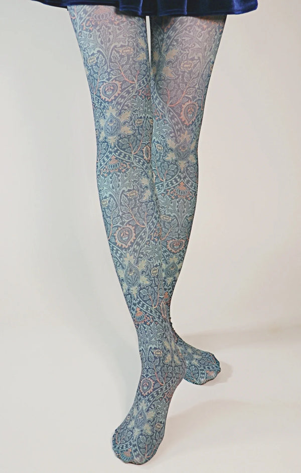 Woman's legs in a velour navy blue skirt wearing Tabbisocks' Ispahan by William Morris Printed Art Tights product