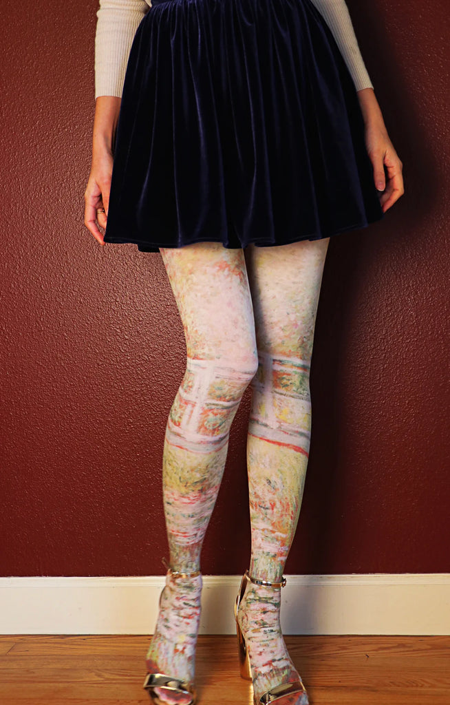 Woman's leg in gold sandals wearing JAPANESE BRIDGE by CLAUDE MONET Printed Art Tights by Tabbisocks