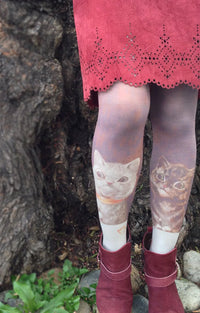 This is a photo of a woman wearing Tabbisocks' product name Louis Wain By Bachelor Party Printed Art Tights with cat print
