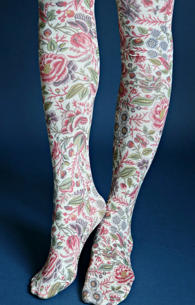 Tabbisocks Rose Flower By Smithsonians Museum Printed Art Tights, a woman wearing tights with a large reddish colored flower and a small floral design throughout, below the knee