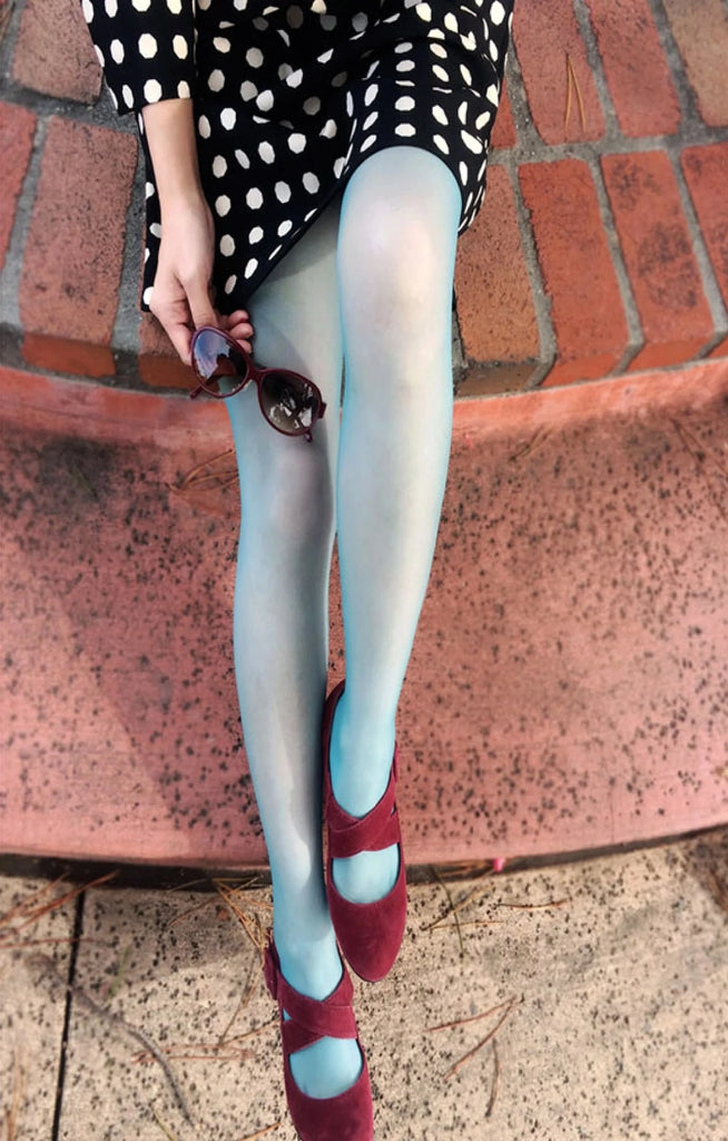 This is a photo of a woman wearing Tabbisocks' product name Sheer Zokki Tights MISTY BLUE