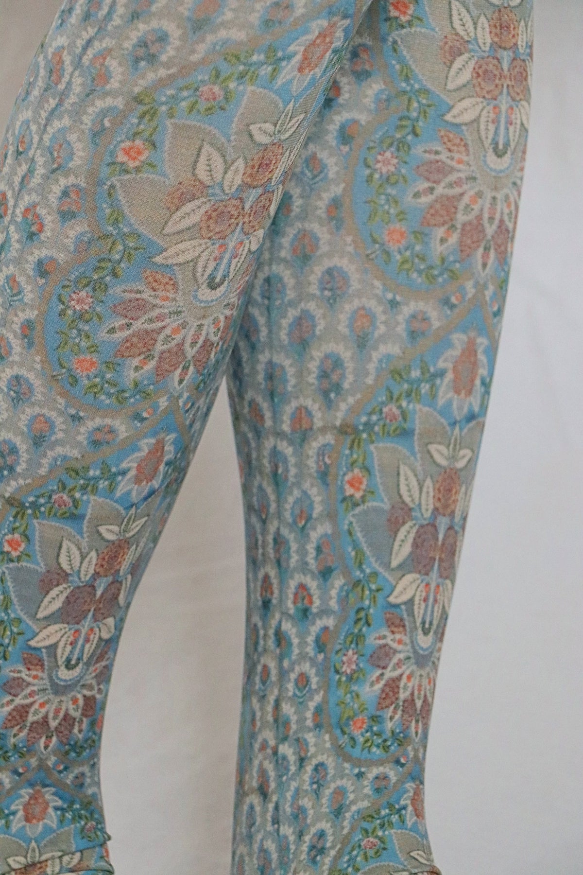 Calf area of a woman wearing a pastel green skirt with Tabbisocks Silk Panel by The Metropolitan Museum of Art Printed Art Tights