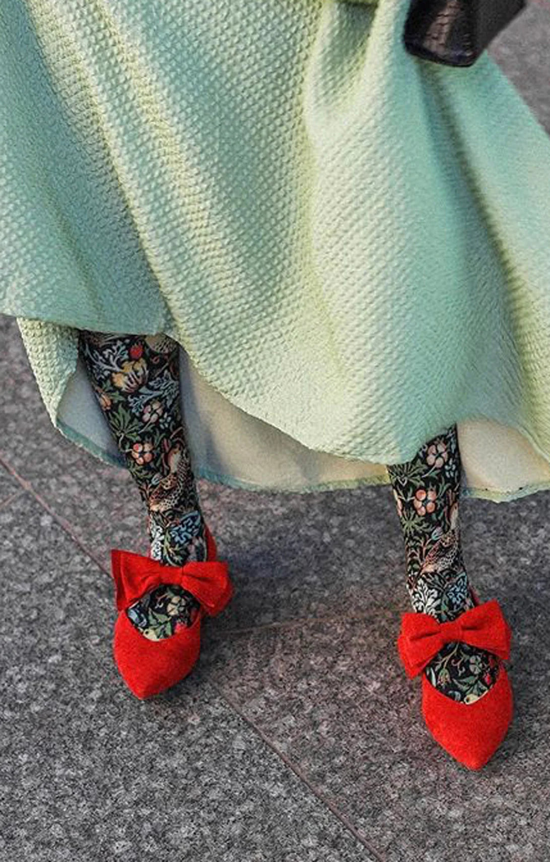 Tabbisocks STRAWBERRY THIEF by Wiiliam Morris Printed Art Tights on a woman's leg with a light green skirt t and red k shoes