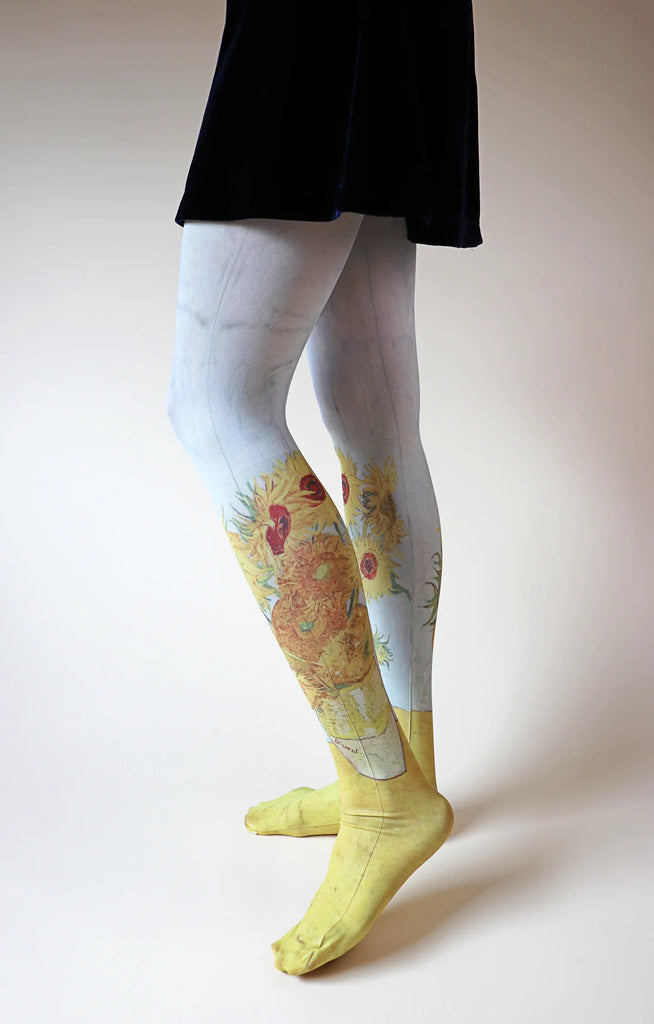 Woman's leg in black skirt seen from the side wearing Tabbisocks SUNFLOWERS 3rd München Version by VAN GOGH Printed Art Tights