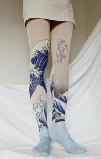 Tabbisocks' The Great Wave off Kanagawa by Katsushika Hokusai Printed Art Tights showing woman in ivory skirt wearing tights, leg at 45 degree angle