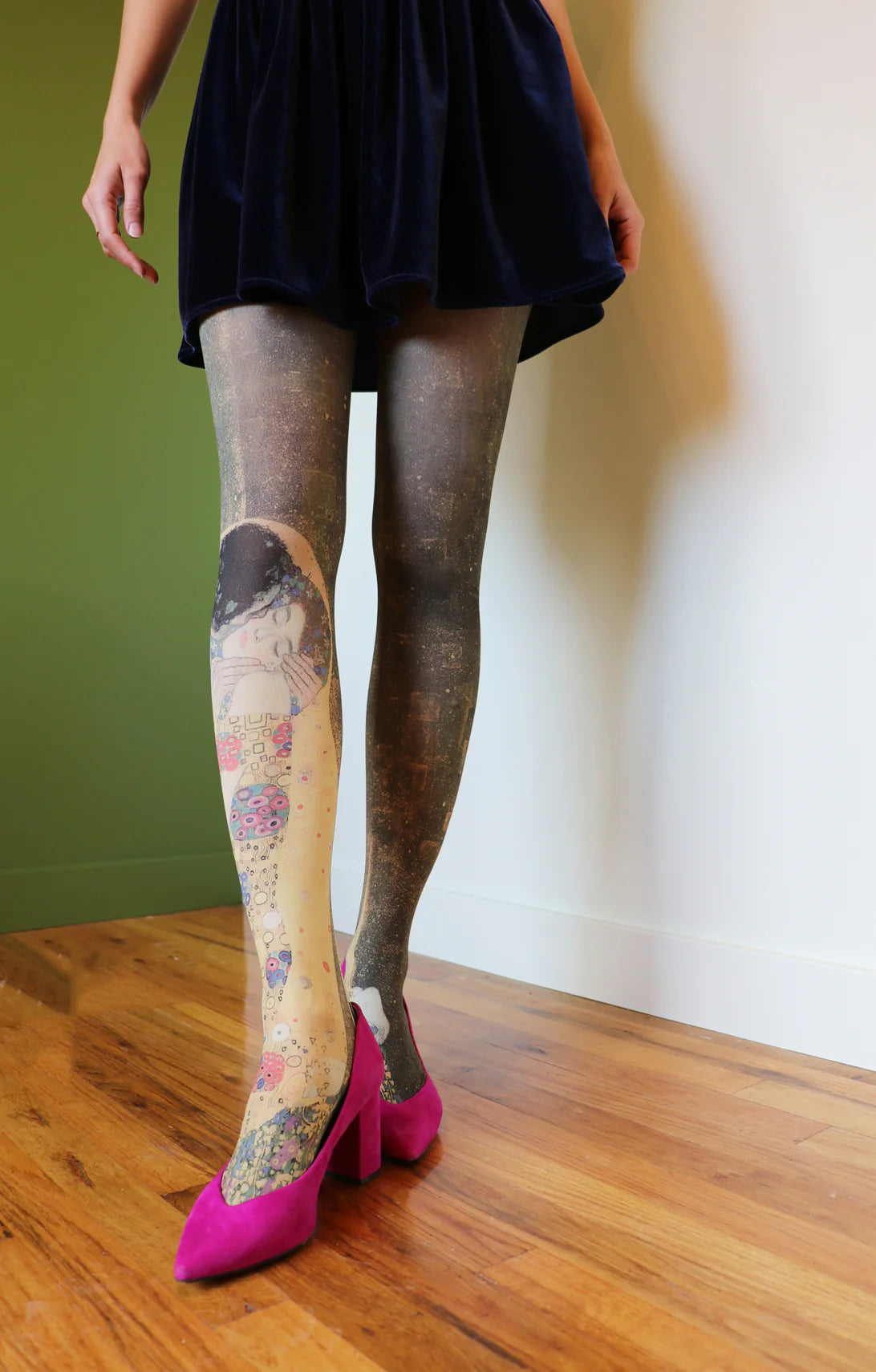 Woman in pink pumps and navy blue velvet fabric skirt wearing The Kiss By Gustav Klimt Printed Art Tights by Tabbisocks