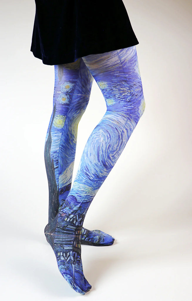 Woman's leg seen from side of black skirt wearing Tabbisocks Van Gogh By The Starry Night Printed Art Tights